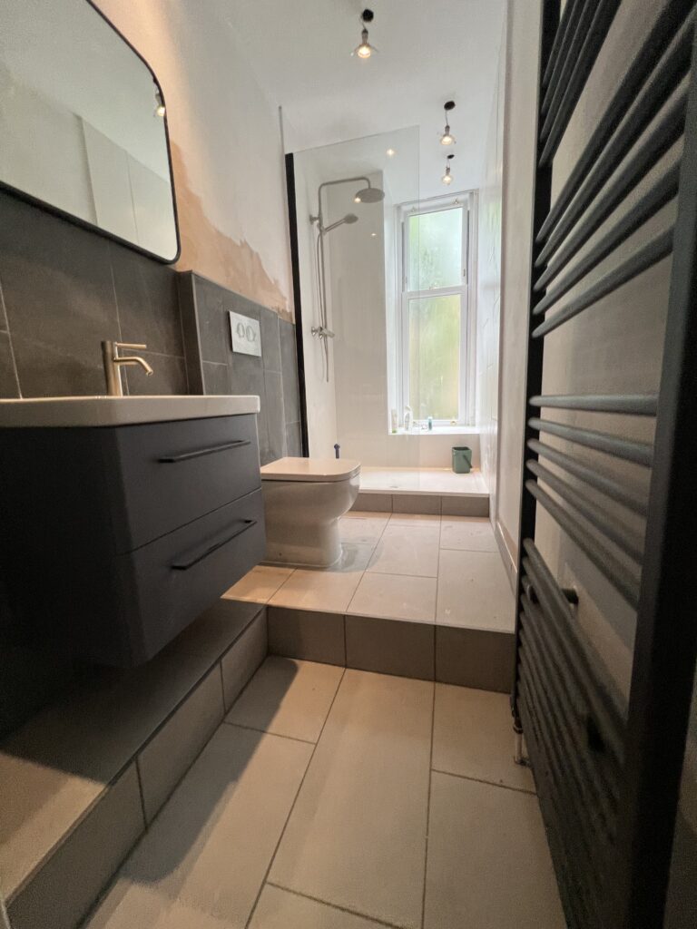 Modern bathroom renovation in Newton Mearns with vanity unit and walk-in shower