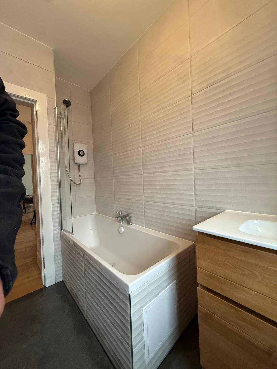 Upstairs bathroom with electric shower after renovation in Glasgow