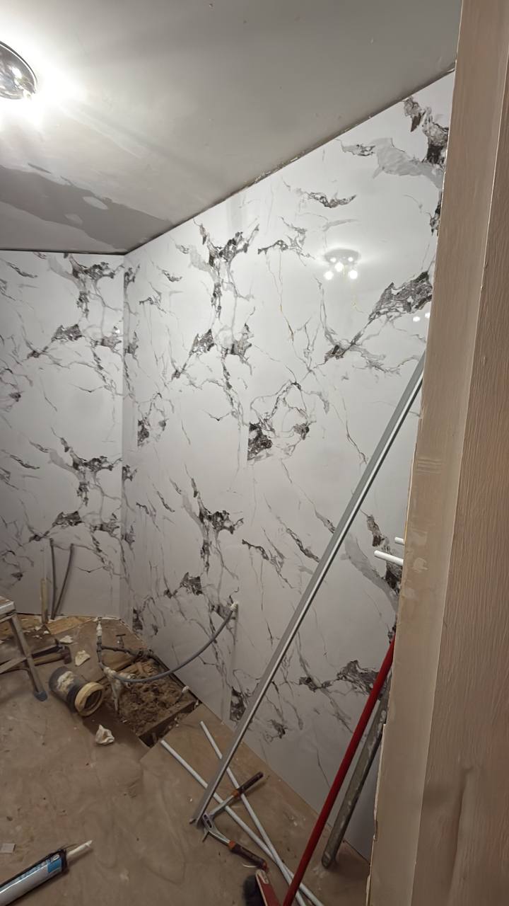 Marble effect tiles going up during bathroom renovation Glasgow