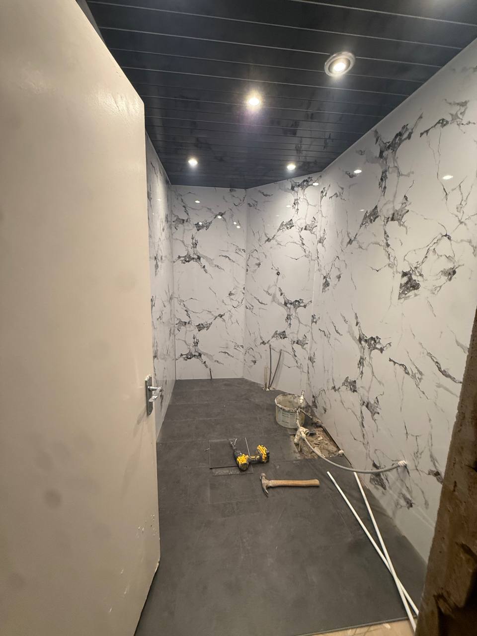 Bathroom tiling complete with dark ceiling Glasgow