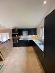 Navy gloss kitchen with timber worktops — kitchen installation Glasgow
