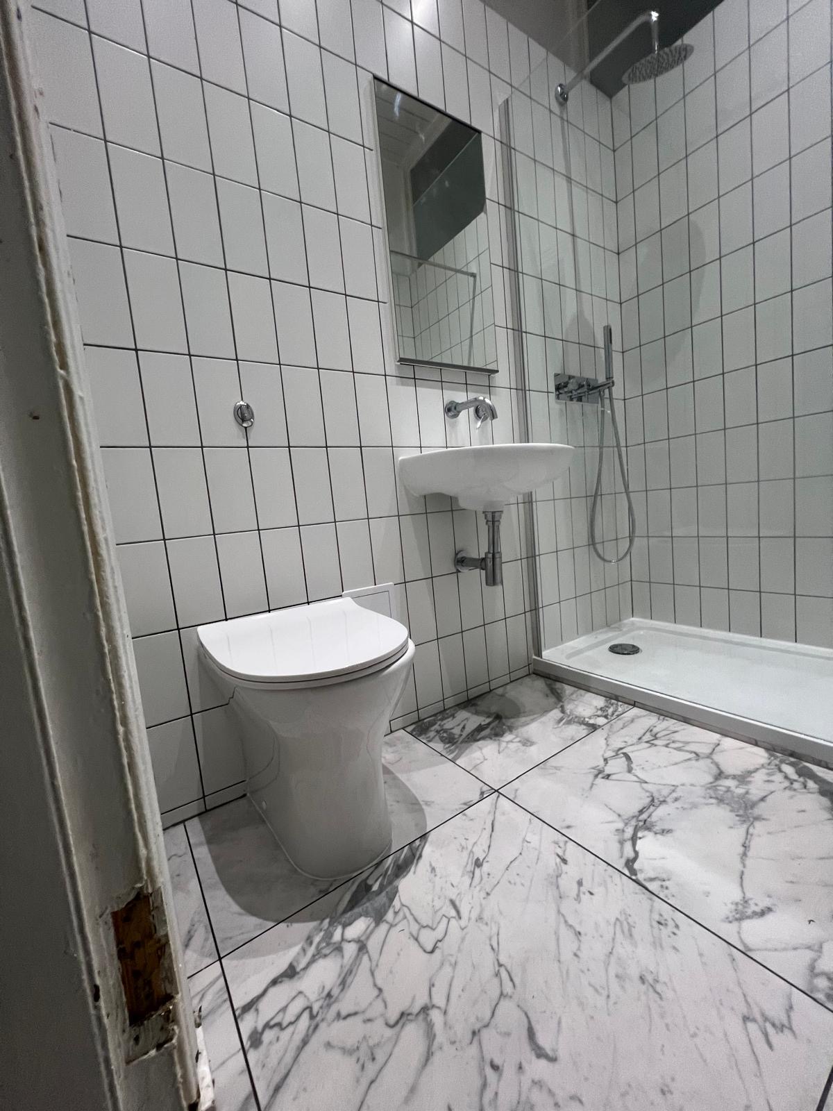 Classic white bathroom renovation Glasgow - metro tiles and marble floor